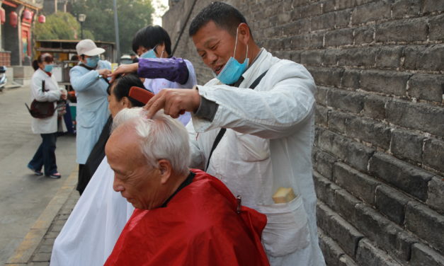 Xi’an’s last remaining street barbers set up shop under the city wall